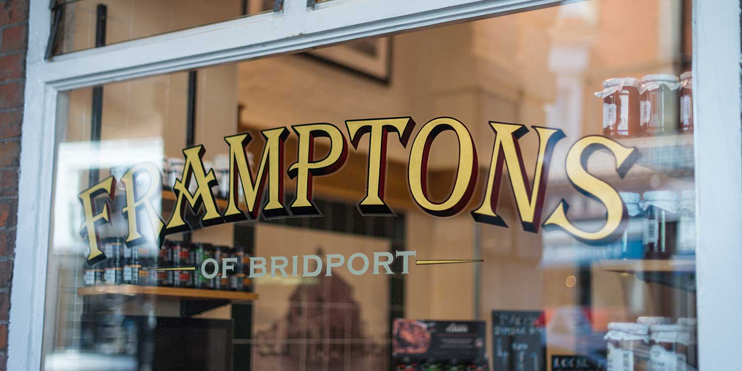 Framptons of Bridport sign in shop window